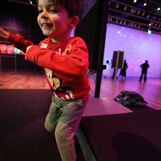 Young Boy Dancing Joyfully at Baby Rave Event
