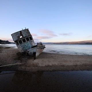 Abandoned Shipwreck on California Coast at Twilight