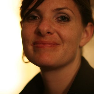 Warm Candlelight Portrait of a Smiling Young Woman