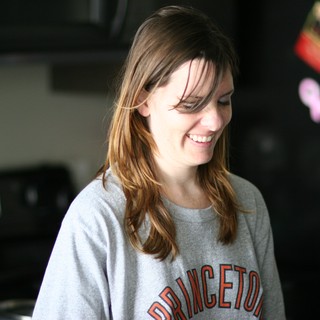Smiling Woman in Princeton Sweatshirt at Home