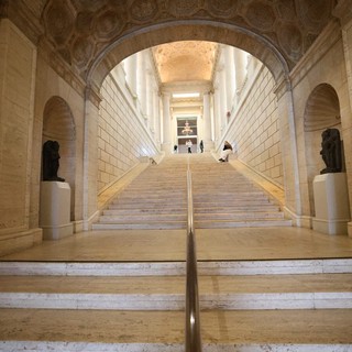 Grand Neoclassical Staircase Under Ornate Coffered Arch