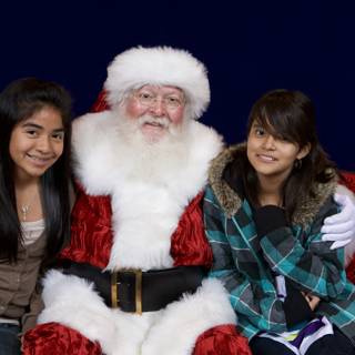 Santa Claus and Two Girls at the APC Xmas Party