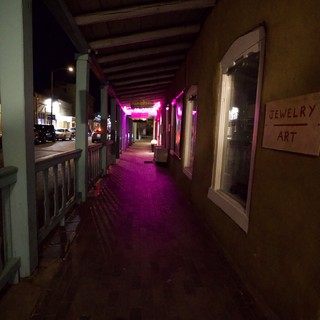 Pink Neon Lit Covered Walkway at Night