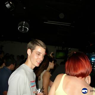 Red-Headed Club-goer in Front of a Crowd