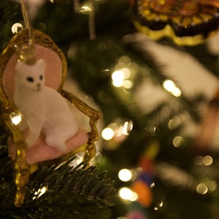 White Cat Christmas Ornament on Illuminated Tree