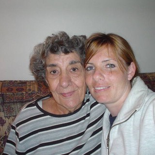Two Generations Share a Warm Couch Moment