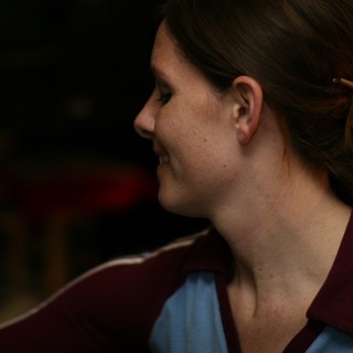 Candid Profile Portrait of a Smiling Woman