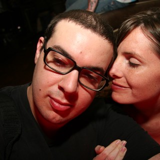 Intimate Moment Between Two Friends at a Nightclub