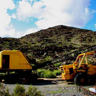 Yellow Bulldozer at the Mountain Range