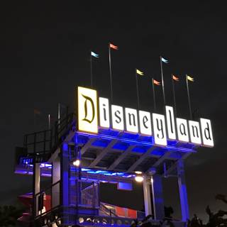 Illuminated Disneyland Sign at Night