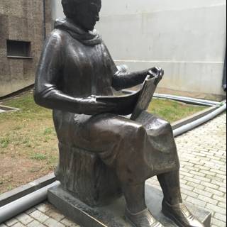 Statue of a Woman Enjoying a Good Read