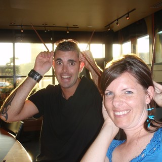 Friends Making Silly Faces at Restaurant Table