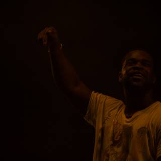 Yellow Shirted A$AP Ferg Throws Up a High Five