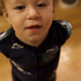 Toddler's Curious Expression on Christmas Morning
