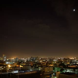 Lunar Eclipse Illuminates Urban Metropolis