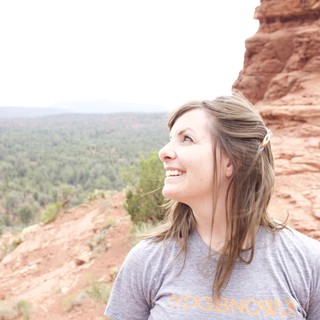 Woman Gazing Up at Sedona Red Rock Formation