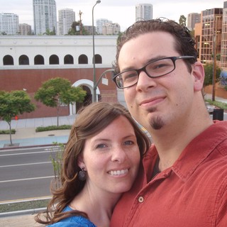 Couple Selfie on Urban Rooftop Overlooking City Street