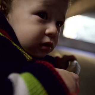 Young Child in Colorful Striped Shirt Close-Up