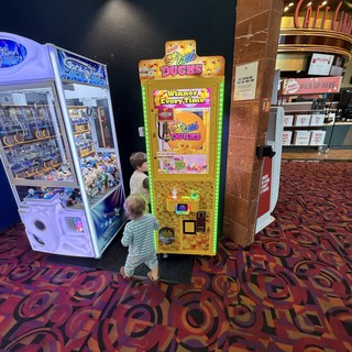 Children Playing Arcade Games at Movie Theater Lobby