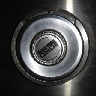 Metal Button Logo on Stove