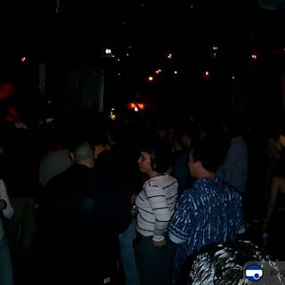Nightclub Crowd Gathers Under Neon Lighting