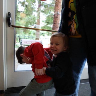 Young Children Pushing Door Together at Skywalker Ranch