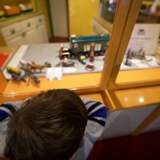 Child Exploring Museum Display from Above