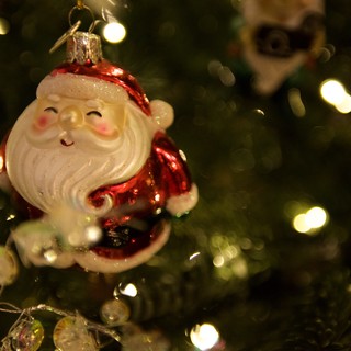 Cheerful Santa Claus Christmas Tree Ornament with Bokeh Lights