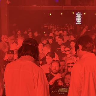 DJ Set in Red Lit Underground Club Atmosphere