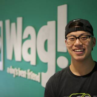 Ning Zetao Smiling in Front of WAG Logo