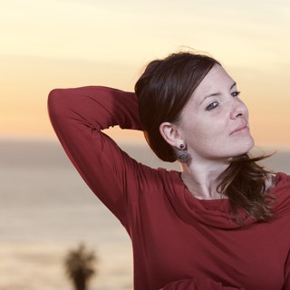 Woman in Red at Golden Hour Seaside