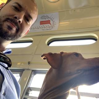 Man and his Furry Companion on a Bus Ride