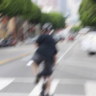 Blurred Cyclist on a Busy Road