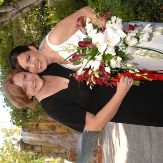 Bride and Friend Embrace Before Wedding Ceremony