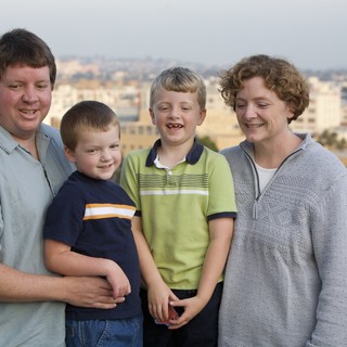 Family Portrait on Urban Rooftop at Dusk