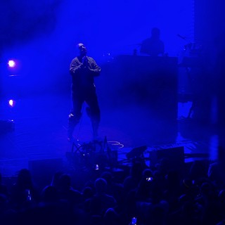 Concert Performer in Dramatic Blue Stage Lighting