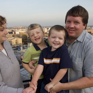 Family Portrait on Urban Rooftop at Dusk