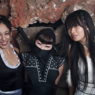 Three Women in Costumes Celebrate Halloween at a Urban Club
