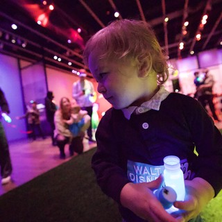 Toddler Enjoying Baby Rave Light Show Experience