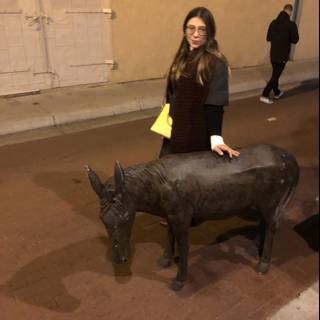 Lori S standing next to statue of a donkey