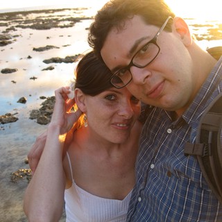 Couple Embracing at Golden Hour Beach Sunset