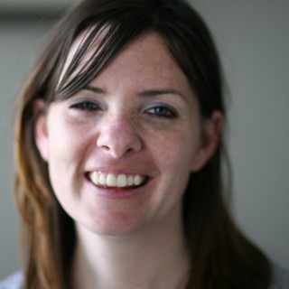 Candid Portrait of a Smiling Young Woman Indoors