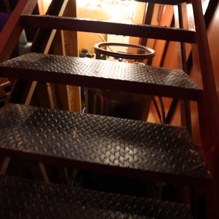 Industrial Steel Staircase Descending Into Dim Basement