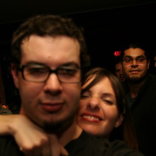 Friends Crowd a Dimly Lit Nightclub in 2005