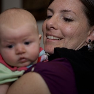 Mother's Joy: Tender Moment with Infant Daughter