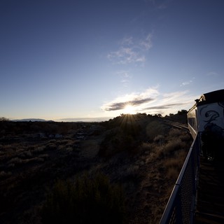 Sunset Over Railroad Tracks with Decorated Building