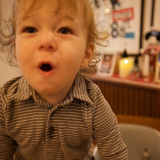 Curious Toddler with Surprised Expression at Home