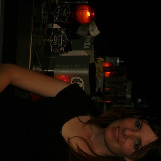 Woman Smiling at New Year's Eve Bar Setup