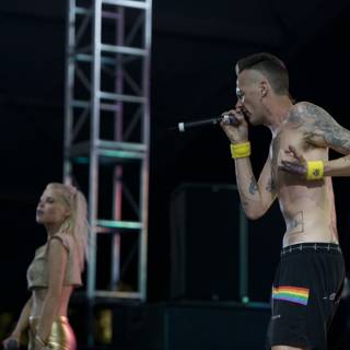 Tattooed Singer Belting Out a Tune on Stage