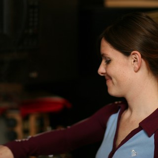 Woman in Profile Smiling Indoors in 2006